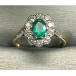 18ct gold diamond and emerald ring central emerald measures approx 7mm by 5mm set with 10 x approx 2