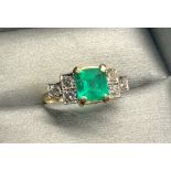 18ct gold diamond and emerald ring central emarald measures approx 7.5mm by 7.5mm set with 6x 3mm di