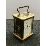 striking brass carriage clockI it has a movement that strikes the hours and half hours on a coiled g