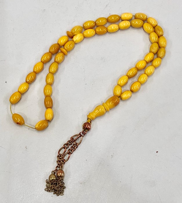 Islamic amber worry beads 45 small beds and 1 big bead the large bead broken in half total weight 20