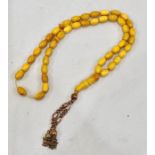 Islamic amber worry beads 45 small beds and 1 big bead the large bead broken in half total weight 20