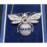 Lare Diamond Sapphire and ruby eye Insect pendantset all over ith diamonds with sapphire band and ru
