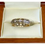 18ct gold and diamond ring set with 10 small diamonds around white and yellow gold