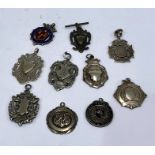 Selection of 8 hallmarked silver Fobs and 2 white metal fobs