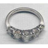 White gold 5 stone diamond ring centre stone measures approx 6mm dia with 2 x 5mm dia stones and 2 x