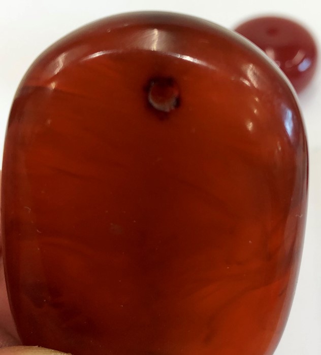 4 large cherry amber bakelite type beads the large bead has good internal streaking - Image 4 of 6