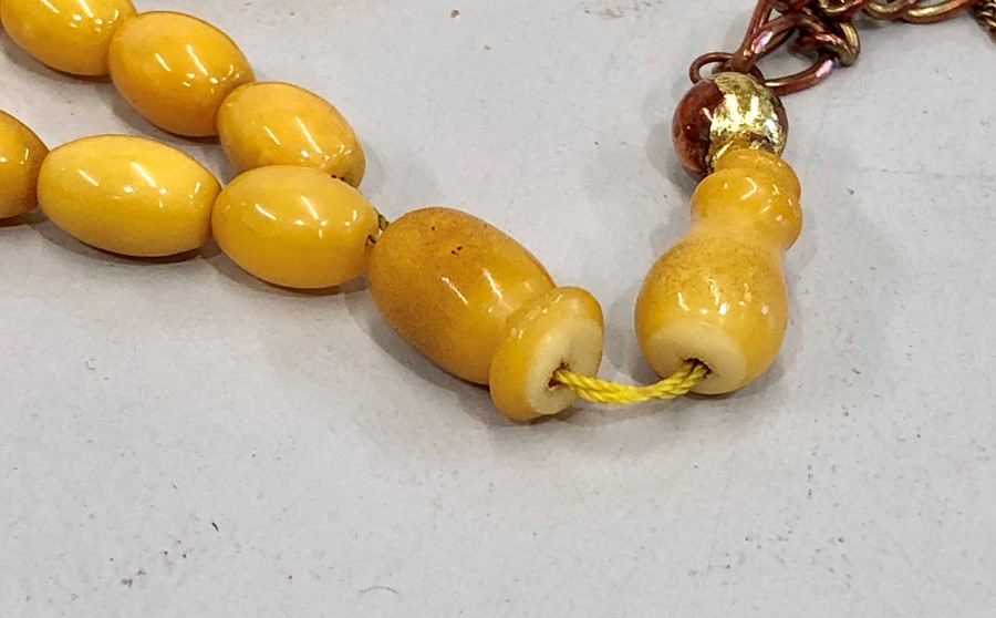 Islamic amber worry beads 45 small beds and 1 big bead the large bead broken in half total weight 20 - Image 4 of 4