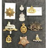 Collection of military items includes victorian Khedive star 2 silver badges and selection of cap ba