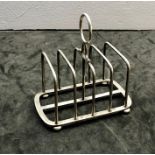 Silver toast rack Birmingham silver hallmarks measures approx 10.5cm long 10cm tall