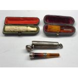 3 Antique c19th century cheroot holders includes Japanese carved dragon , Amber and one with silver