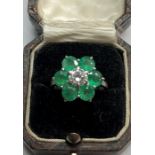 Fine 18ct white gold diamond and emerald ring set with large central diamond that measures approx sl