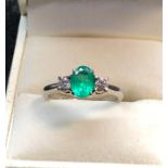 Platinum Emerald and Diamond ring hallmarked 950 set with central emerald measures approx 8mm by 6.5