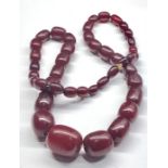 large Vintage cherry amber bakelite barrel shaped bead necklace largest bead measures approx 30mm by