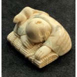 Fine Signed japanese Netsuke fig of boy sleeping with rodent on his shoulder measures approx 35mm wi