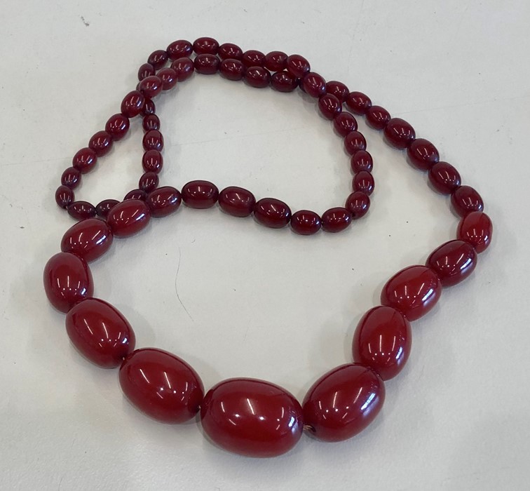 Cherry amber / bakelite type bead necklace no streaking when looked under light largest bead measure