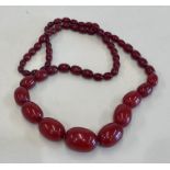 Cherry amber / bakelite type bead necklace no streaking when looked under light largest bead measure