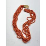 ntwined coral bead necklace with gold clasp measures approx 45cm long