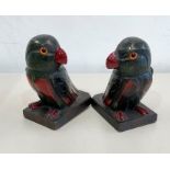 Pair of art deco parrot bookends glass eyes 1 missing with cherry amber / bakelite type beak and cla