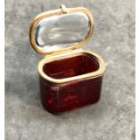 Victorian 19th century ruby glass trinket box made from thick heavy glass with brass mounts measures