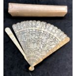 19th century Chinese Canton ivory fan with box the outer guards and sticks with ornate carving some