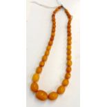 Vintage egg yolk amber bead necklace largest bead measures approx 18mm by 12mm weight approx 17g tot