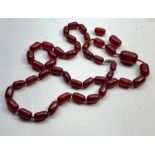 Cherry amber / bakelite barrel bead necklace good internal streaking measures approx 90cm long barre