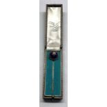 Antique diamond stick pin set with central diamonds set in blue enamel head in high carat gold not h