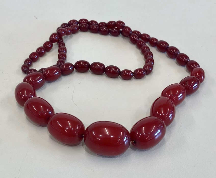 Cherry amber / bakelite type bead necklace no streaking when looked under light largest bead measure - Image 2 of 3