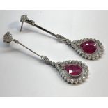 Fine pair of 18ct white gold diamond and ruby drop earrings set with large tear drop rubies each mea