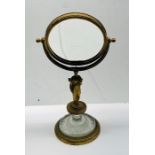 Fine Quality French Empire bronze toilet mirror with a Grecian female supporting the adjustable mirr