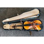 Boxed violin and bow label reads stradivarius