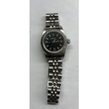 Ladies rolex oyster perpetual wristwatch black dial