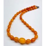 Vintage egg yolk amber bead necklace largest bead measures approx 22mm by 17mm length 44cm weight 27