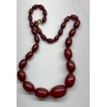 Cherry amber / bakelite bead necklace good internal streaking measures approx 56cm long graduated be