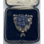 large antique continental Rose diamond clip set win silver with a large blue stone flower head with