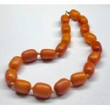 Vintage barrle shaped egg yolk amber bead necklace largest bead measures approx 22mm by 16mm length