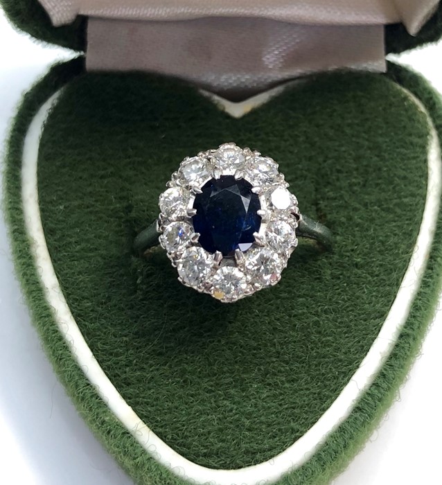 Vintage platinum diamond and sapphire ring set with central sapphire that measures approx 7mm by 6mm