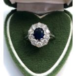 Vintage platinum diamond and sapphire ring set with central sapphire that measures approx 7mm by 6mm