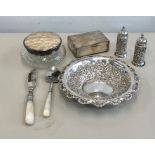 Collection of silver items includes salts trinket jar dish and silver spoon and knife