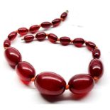 Cherry Amber / bakelite bead necklace good internal streaking largest bead measures approx 29mm by 2