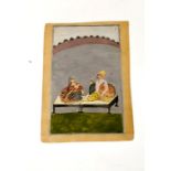 North Indian miniature painting. Provincial Mughal, of a romancing couple seated on low stools in a