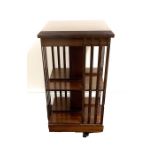 Revolving bookcase measures approx height 34" width 18" depth 18"