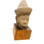 Cambodian stone head mounted on wood plinth