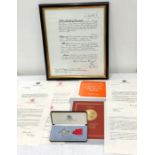 O B E Medal and paper work includes framed signed Elizabeth 11 certificate original boxed medal