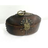 Yemenese carved wood box with lid, brass handle and clasp, nail studded, collector’s label to base,