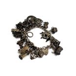 Vintage 925 sterling silver charm bracelet loaded with a mixture of charms (109g) Clasp in good work