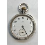 Silver Omega pocket watch winds and ticks but no warranty given in good overall condition small de