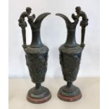 Pair of 19th century Bronze ewers on red marble bases Grand Tour Bachanalian scenes height 44cm