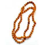 Antique egg yolk amber bead necklace even sized beads measures aoorox 9.5cm dia length 91cm weight a