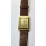 Vintage Gents 18ct gold Omega Geneve wristwatch the watch winds and ticks not no warranty given mea